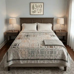 Woven Stillness queen quilt in a neutral bedroom with dark wood furniture.